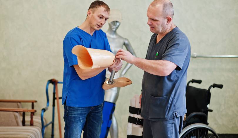 Physiotherapist guiding a patient through fracture recovery exercises.