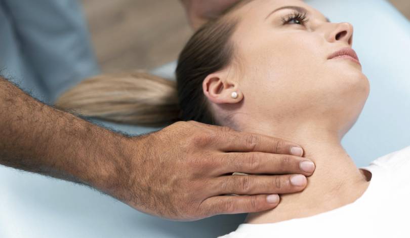 Physiotherapist guiding neck pain exercises for recovery