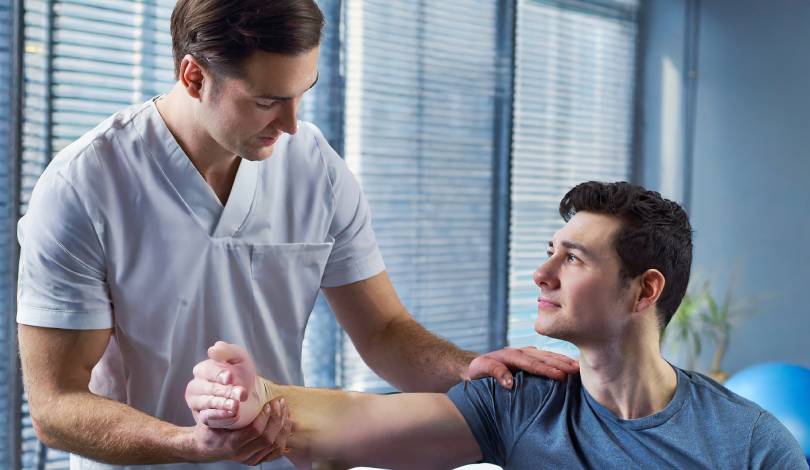 Physiotherapist applying manual therapy for shoulder pain relief
