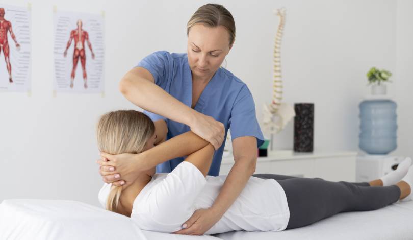 Physiotherapist performing cervical mobilisation on patient