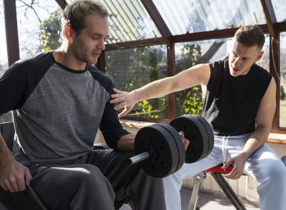 medium-shot-friends-training-together-with-dumbbells