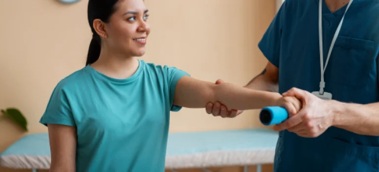 physiotherapist-treating-tennis-elbow-with-therapy
