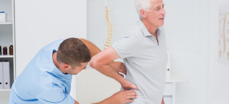 spine-specialist-physical-therapy-performing-manual-vertebral-mobilization