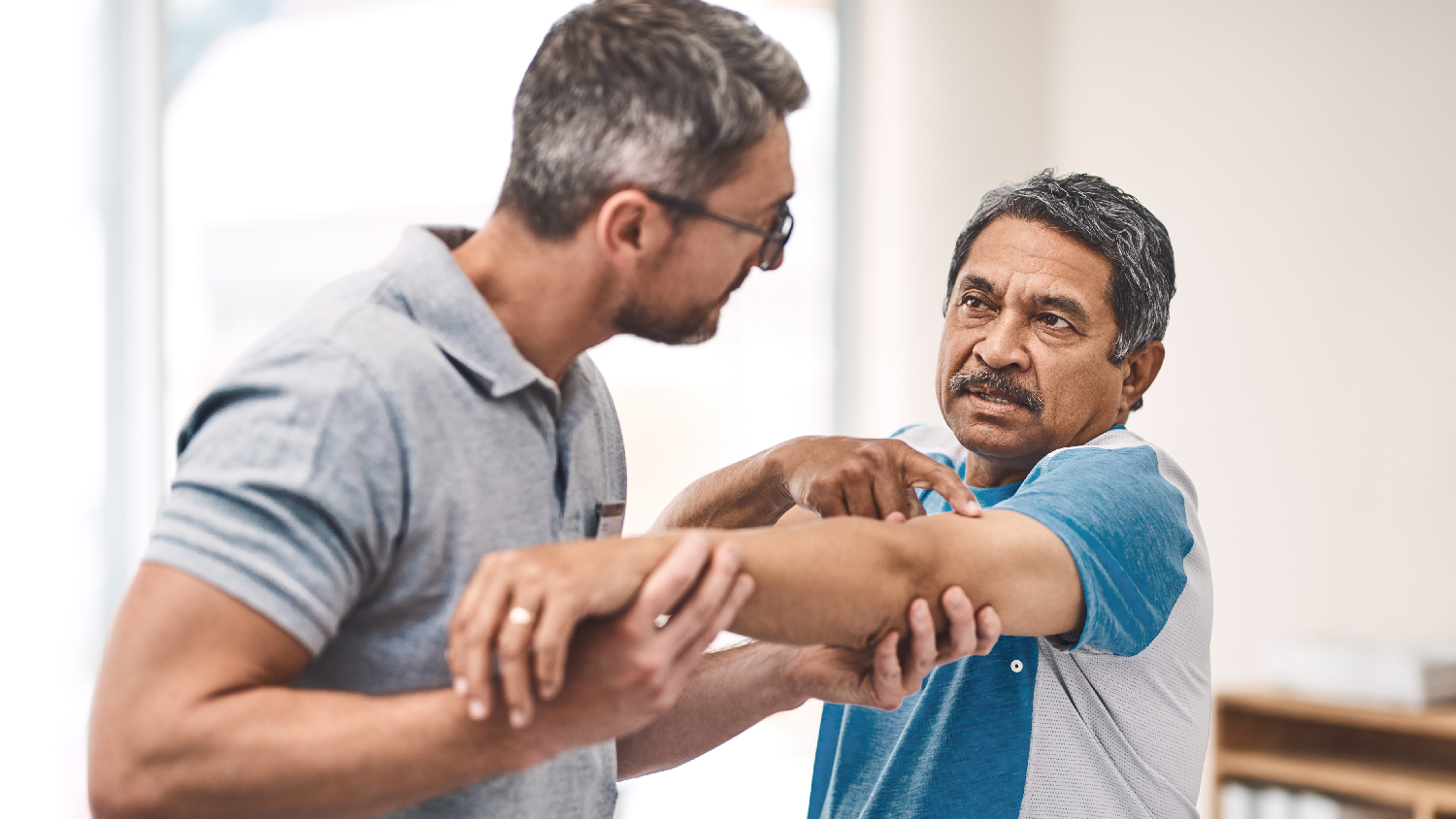 physiotherapist-applying-gentle-manual-cervical-mobilization-for-spondylosis