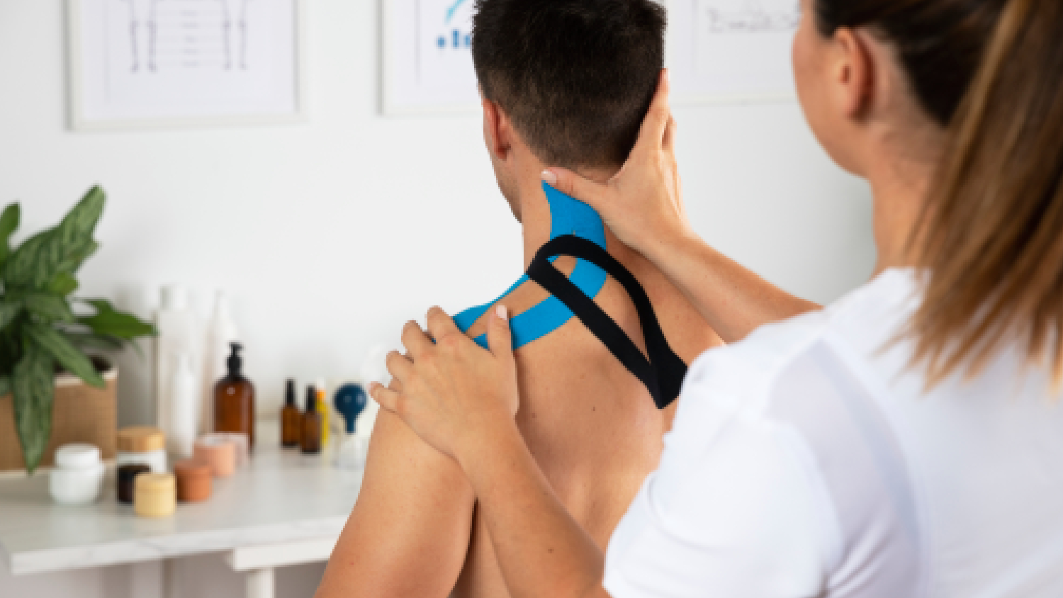 physiotherapist-applying-therapeutic-taping-for-physiotherapy-for-tennis-elbow