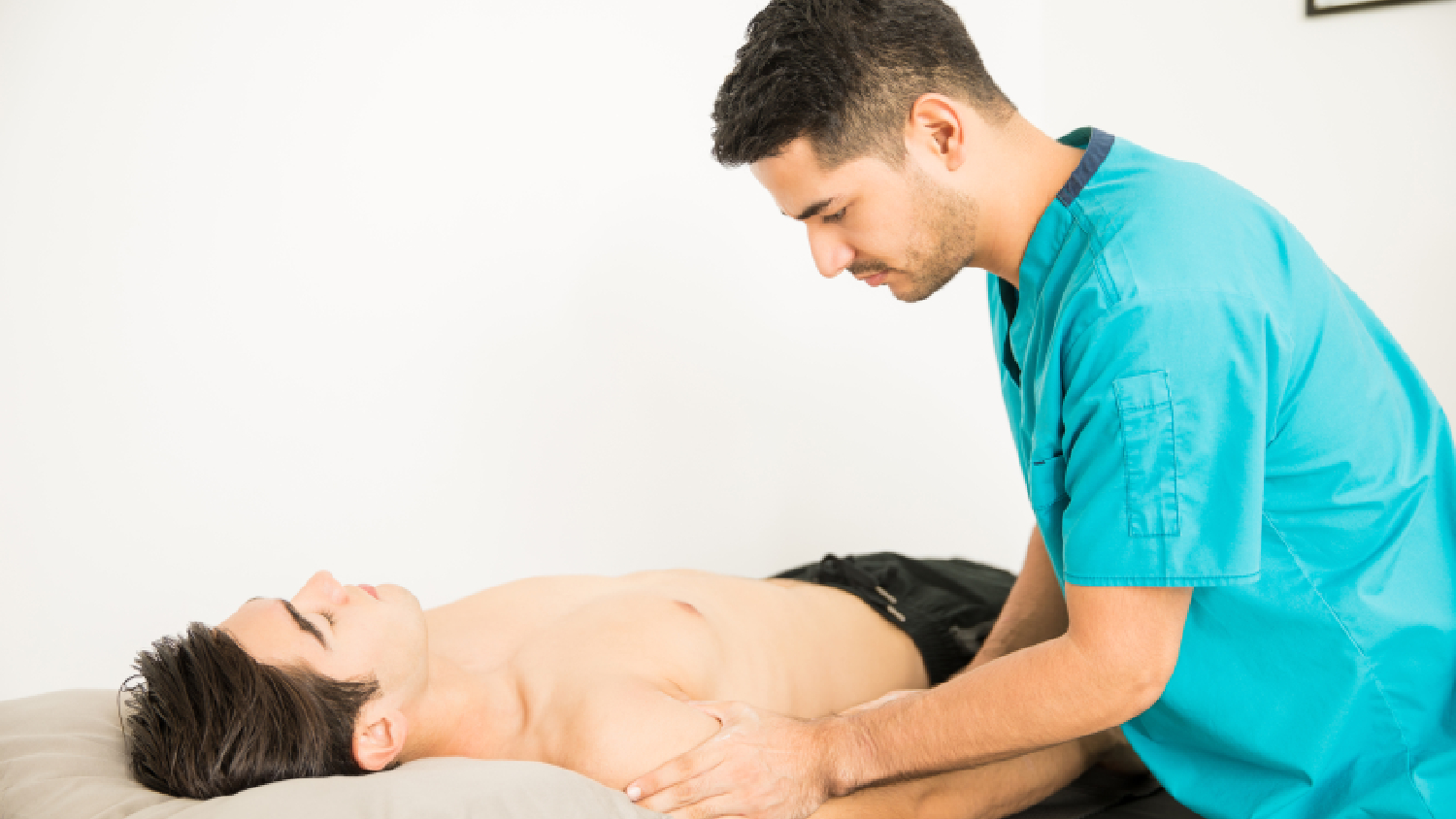 physiotherapist-performing-manual-traction-for-backache-physiotherapy