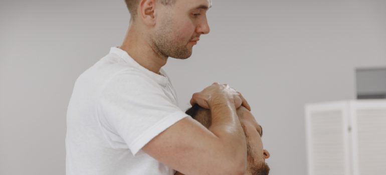 physiotherapist-performing-gentle-mobilization-for-physiotherapy-for-cervical-spondylitis