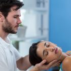 physiotherapist-performing-gentle-mobilization-for-physiotherapy-for-cervical-spondylitis