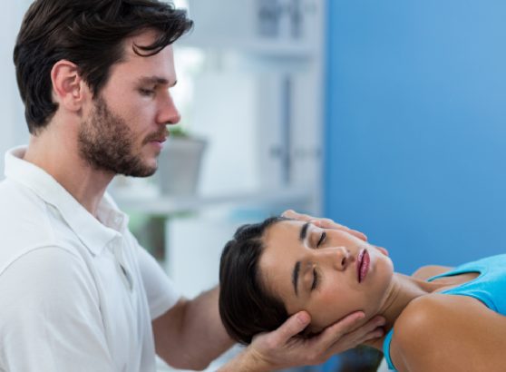 physiotherapist-performing-gentle-mobilization-for-physiotherapy-for-cervical-spondylitis