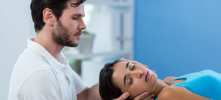 physiotherapist-performing-gentle-mobilization-for-physiotherapy-for-cervical-spondylitis