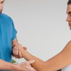 physiotherapist-applying-gentle-joint-mobilization-techniques-for-frozen-shoulder-treatment