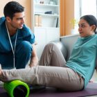 athlete-performing-functional-rehabilitation-exercises-under-the-guidance-of-a-sports-physio