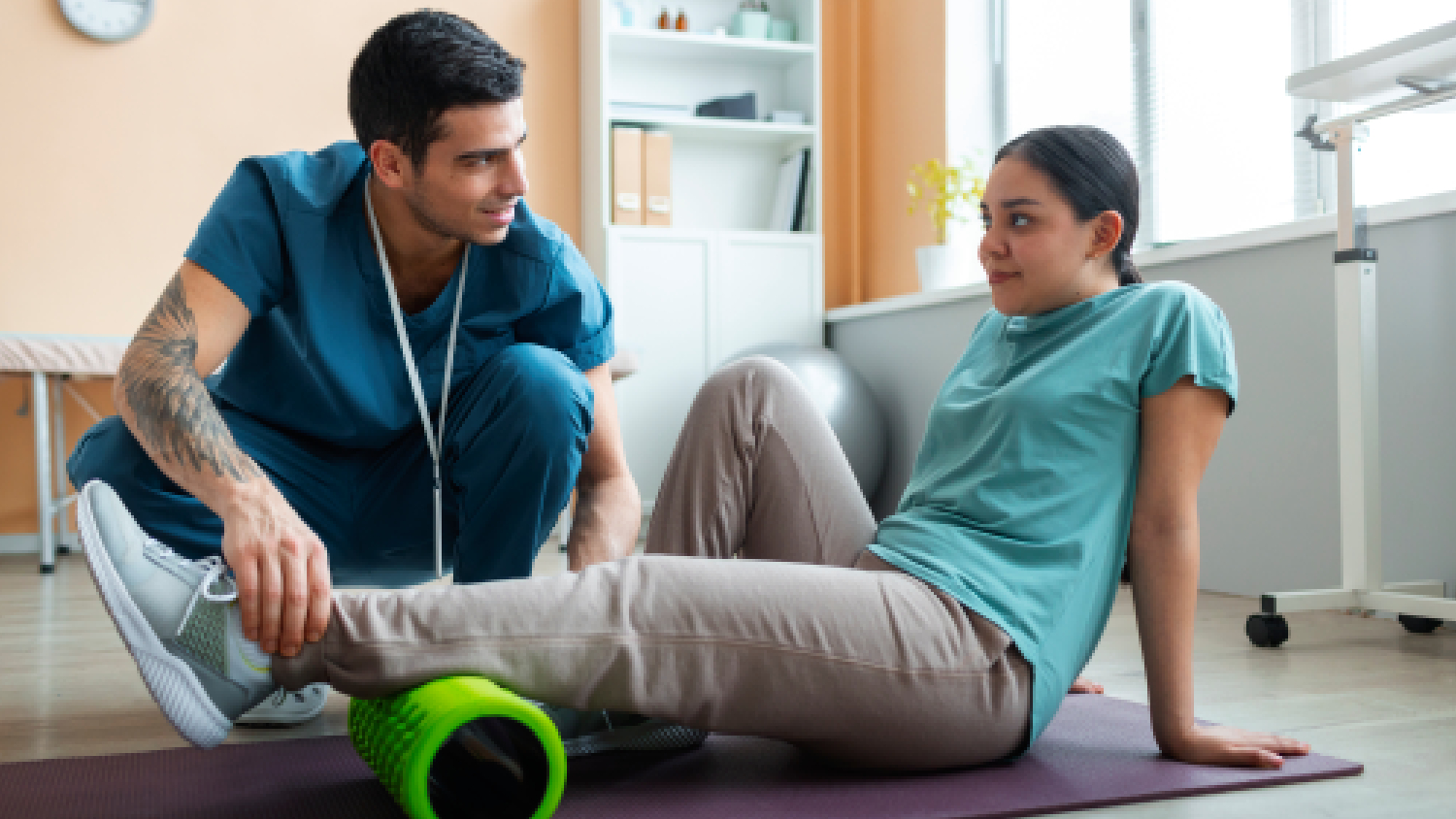 athlete-performing-functional-rehabilitation-exercises-under-the-guidance-of-a-sports-physio