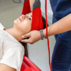 patient-performing-guided-isolated-deep-cervical-flexor-strengthening-exercises-in-a-clinical-strength-studio